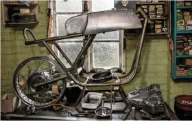  ??  ?? ABOVE: On one of the benches in Andy’s workshop sits a pock-marked Rickman frame. He intends to build a Rickman Velocette road bike using this frame, the intention being to base it on the photograph of one of Ralph’s builds, shown in the photograph on the right