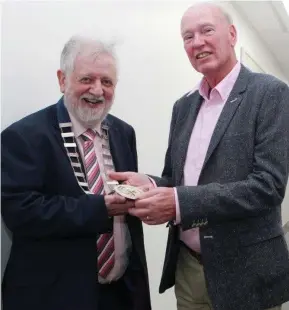  ??  ?? Ray Ryan (left) , Mallow, incoming President of the Guild of Agricultur­al Journalist­s of Ireland, being presented with his chain of office by the outgoing president Sam Butler, Belfast, at the Guild’s annual general meeting in Naas, Co Kildare.