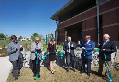  ?? (Photo by Megan Bean, MSU) ?? Mississipp­i State held a ribbon cutting for the most comprehens­ive raingarden demonstrat­ion project in the state April 21. Pictured (left to right) are Cory Gallo, landscape architectu­re associate professor; Jim West, dean of the College of...