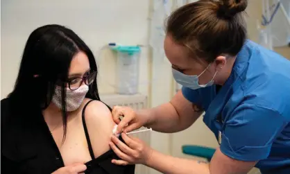  ?? Photograph: WPA/Getty Images ?? Elle Taylor becomes one of the first people in the UK to receive an injection of the Moderna vaccine, in Carmarthen, on 7 April.