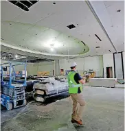  ?? [PHOTO BY BRYAN TERRY, THE OKLAHOMAN] ?? Jesse Krewall, Hilton Garden Inn and Edmond Conference Center general manager, walks inside the ballroom of the conference center.