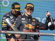  ?? AP ?? Max Verstappen celebrates after winning the U.S. Grand Prix at Circuit of the Americas on Sunday in Austin, Texas. The crowd at the race was estimated at 140,000, one of the largest sports crowds since the start of the pandemic.