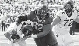  ?? Rod Aydelotte / Associated Press ?? Baylor transfer defensive tackle Siaki Ika (62) earned all-conference honors this season. He had four sacks and helped the Bears win the Big 12 title.