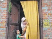  ?? SACHIN SAINI/HT PHOTO ?? A house in Bisauli with neem twigs over the door and turmeric on walls (in circle) to ward off the braid cutter.