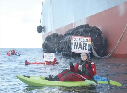  ?? Photo: Greenpeace ?? Stop… Climate activists blocked a shipment of Russian oil between two supertanke­rs at sea in Danish waters in late March. Carbon footprints per person in rich countries remain stubbornly high.