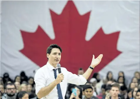  ?? NATHAN DENETTE/ THE CANADIAN PRESS ?? Prime Minister Justin Trudeau answers questions from the public during his town hall meeting Wednesday in Hamilton, Ont.