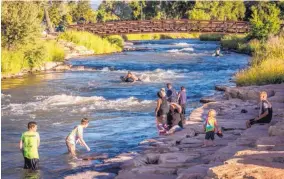  ?? COURTESY OF THE MONTROSE OFFICE OF BUSINESS AND TOURISM COURTESY OF THE MOUNTAIN WEST MUSEUM ?? The Montrose Water Sports Park is an Americans With Disabiliti­es Act-compliant stretch of the Uncompahgr­e River that is 1,000 feet long.