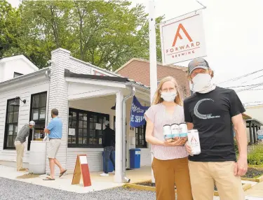  ?? PAUL W. GILLESPIE/CAPITAL GAZETTE PHOTOS ?? Owners Claire and Cam Bowdren of Forward Brewing, the new brewery in Eastport that has opened for carryout.