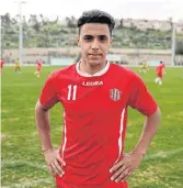  ??  ?? HAPPY TO SIGN: Mahmoud Awiset, a 19-year-old Palestinia­n, plays for Hapoel Katamon.