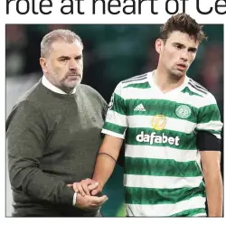  ?? ?? HARSH LESSON: Matt O’Riley is consoled by Ange Postecoglo­u after Celtic’s Champions League defeat in Leipzig