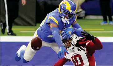  ?? AP PHOTO BY JAE C. HONG ?? Los Angeles Rams cornerback Jalen Ramsey (20) defends a pass intended for Arizona Cardinals wide receiver Deandre Hopkins (10) during the second half of an NFL football game in Inglewood, Calif., Sunday, Jan. 3.