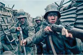  ?? Reiner Bajo/Netflix ?? Felix Kammerer, Albrecht Schuch, Edin Hasanovic in “All Quiet on the Western Front.” The film won seven prizes, including best picture, at the British Academy Film Awards on Sunday