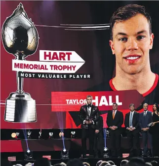  ?? ETHAN MILLER/GETTY IMAGES ?? Taylor Hall accepts the Hart Trophy Wednesday during the NHL awards in Las Vegas. The league’s MVP notched 93 points with the New Jersey Devils in 2017-18.