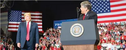  ?? AP FILES ?? Then-President Donald Trump listens as Fox News’ Sean Hannity speaks at a 2018 Trump rally in Cape Girardeau, Mo.