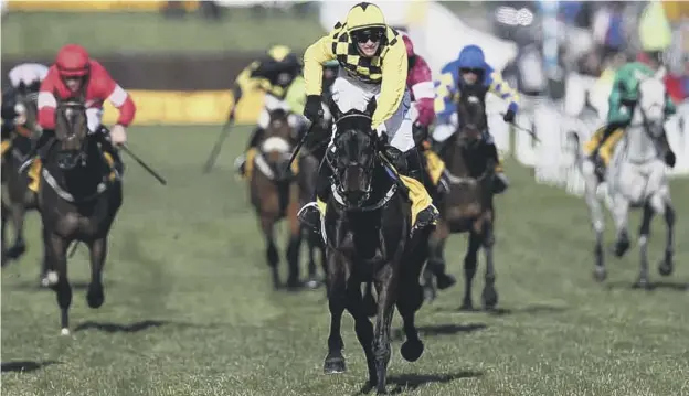  ??  ?? 0 Jockey Paul Townend rides Al Boum Photo to victory in the Magners Cheltenham Gold Cup Chase in March