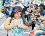  ?? SUBMITTED PHOTO ?? Sasha Meana holds the ceremonial key to her family’s new home provided by Habitat for Humanity of Broward.