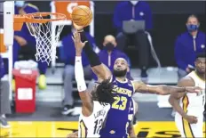  ?? AP photo ?? The Lakers’ LeBron James defends against the Pelicans’ Kira Lewis Jr. during the fourth quarter Friday.