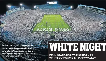  ?? THE ASSOCIATED PRESS] [CHRIS KNIGHT/ ?? In this Oct. 21, 2017, photo, Penn State takes the opening kick off in a “whiteout” game, during the first half against Michigan.