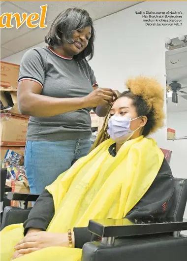  ?? ?? Nadine Djuiko, owner of Nadine’s Hair Braiding in Bowie, does medium knotless braids on Debrah Jackson on Feb. 7.