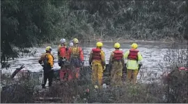  ?? Mark Boster Los Angeles Times ?? A CREW prepares to rescue two homeless women stranded last month on an island in the San Gabriel River in El Monte. A helicopter was used to save the pair.