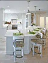  ?? Photo courtesy of Taylor Photograph­y ?? Comfort and style are important, when selecting bar stools, as for this kitchen designed by interior designer Ken Olsen, allow for at least 6 inches between stools, and 10 inches between the seat and the bottom of the counter.