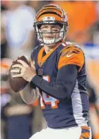  ?? ANDY LYONS/GETTY IMAGES ?? Bengals quarterbac­k Andy Dalton threw four touchdown passes in the first half Thursday against the Ravens.