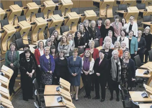  ?? PICTURE: LISA FERGUSON ?? 0 Holyrood’s female MSPS gathered to celebrate the centenary of the Representa­tion of the People Act