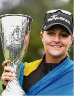  ??  ?? One tough girl: Sweden’s Anna Nordqvist holding her trophy after winning the Evian Championsh­ip on Sunday. — AFP