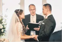  ?? PHOTO: DAWN THOMSON PHOTOGRAPH­Y ?? ‘‘Beautiful wedding’’ . . . Celebrant Peter Doyle (centre) marries Karel Sroubek, aka Jan Antolik, in 2016.