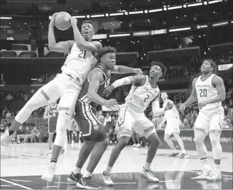  ?? Gina Ferazzi Los Angeles Times ?? USC FRESHMAN Onyeka Okongwu grabs a rebound against Louisiana State in December. The season ended abruptly this week.