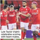  ??  ?? Lyle Taylor (right) celebrates scoring with team-mates.