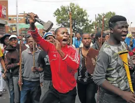  ?? /The Times ?? Insular: Xenophobic attacks and protests, such as this one in Johannesbu­rg in 2015, are an extension of the unwelcomin­g attitude among African government­s towards economic integratio­n.