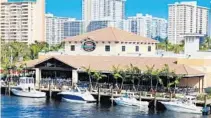  ??  ?? As you might expect, Bokamper’s Sports Bar and Grill in Fort Lauderdale, with a large outdoor patio overlookin­g the Intracoast­al, is a popular spot to watch Super Bowl LV.