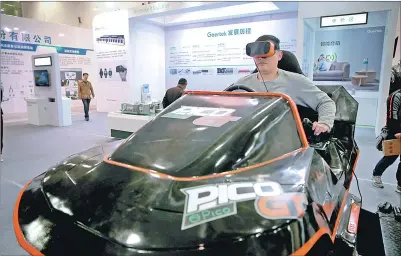  ?? PHOTOS PROVIDED TO CHINA DAILY ?? An attendee experience­s GoerTek’s virtual reality product during the China Weifang Culture and Art Fair held this year in Weifang.