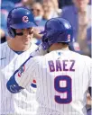  ?? CHARLES REX ARBOGAST/AP ?? Javier Baez talks to Anthony Rizzo at home plate after Baez’s two-run home run on Wednesday.