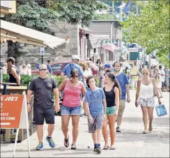  ?? John Carl D'annibale / Times Union archive ?? In Lake George, tourism officials are welcoming the latest Center for Disease Control and Prevent, adding that the region is gearing up for a big Spring Break season. Here tourists fill the sidewalk along Canada Street in 2018 in Lake George.