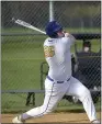  ?? PETE BANNAN — MEDIANEWS GROUP ?? Downingtow­n West’s Cooper Young strokes a two-run home run in the sixth inning to tie the score.