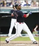  ?? AP photo ?? Edwin Encarnacio­n of the Indians hits an RBI single during the third inning Wednesday.