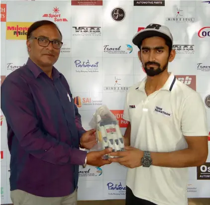  ??  ?? Yash Kothari ( right) poses with his man of the match trophy.