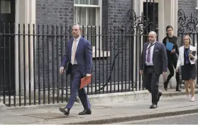  ?? Matt Dunham / Associated Press ?? Foreign Secretary Dominic Raab (left) is the acting prime minister while Boris Johnson is in an intensive care unit for a worsening case of the coronaviru­s.