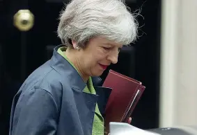  ?? (Afp) ?? Downing Street La premier britannica Theresa May, 61 anni. all’uscita dalla sede del governo
