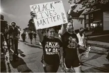  ?? Kamil Krzaczynsk­i / AFP via Getty Images ?? The police shooting of Jacob Blake draws protesters Wednesday in Kenosha, Wis., and nationwide.