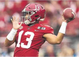  ?? EZRA SHAW GETTY IMAGES FILE ?? Alabama’s Tua Tagovailoa — a born righty converted by his dad — could go No. 1 in the next NFL draft and enter a league with no other left-handed quarterbac­ks.