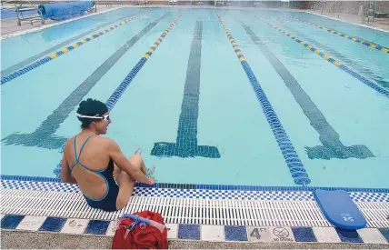  ?? ADOLPHE PIERRE-LOUIS/JOURNAL ?? Martha Weisler gets ready to swim laps at the Jewish Community Center pool Wednesday.