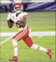  ?? Rob Carr / Getty Images ?? Mecole Hardman of the Chiefs scores a TD against Ravens. The game didn’t end in time for this edition. Go to: