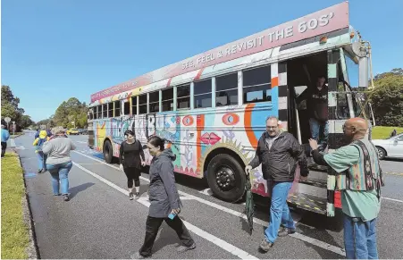  ?? TNS PHOTOS ?? MAGIC BUS: The psychedeli­c Magic Bus, above and opposite, takes passengers on a two-hour tour of San Francisco. Jessica ‘Moon Babe’ Risco, top, leads people through the trippy journey.