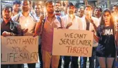  ??  ?? Resident doctors of Nair hospital hold a candle march on Monday against the state government’s decision to remove MSF (Maharashtr­a Security Force) from hospitals across Maharashtr­a.