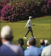  ?? Associated Press ?? ELITE
Rory McIlroy, of Northern Ireland, walks across the green on the 13th hole during a practice round for the Masters golf tournament on Tuesday in Augusta, Ga.