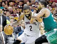 ?? AP/TONY DEJAK ?? Cleveland guard Kyrie Irving tries to get past Boston defender Marcus Smart during Game 4 of the NBA Eastern Conference finals Tuesday night. Irving scored 21 of his game-high 42 points in the third quarter to power the Cavaliers to a 112-99 victory.