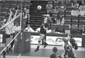  ??  ?? HOMETOWN GIRL: Kori Bullard, a multi-sport performer from Lake Hamilton, goes up for a return as Ouachita Baptist faces Southern Nazarene in a Great American Conference volleyball quarterfin­al Thursday at Bank of the Ozarks Arena. Receiving honorable...